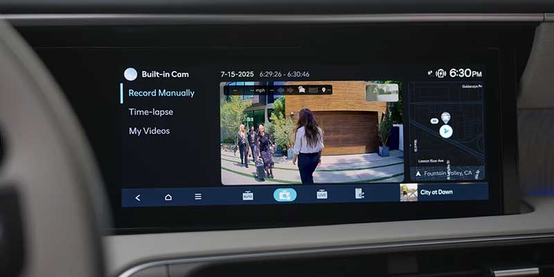 A car's built-in camera screen displaying video recording options, time-lapse, and GPS location.