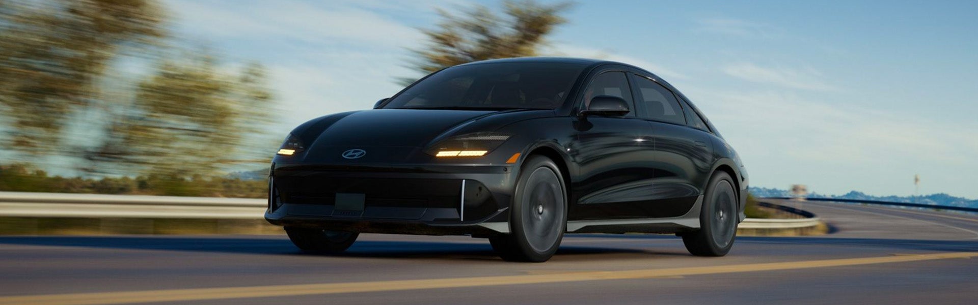 Black Hyundai Ioniq 6 driving on the road